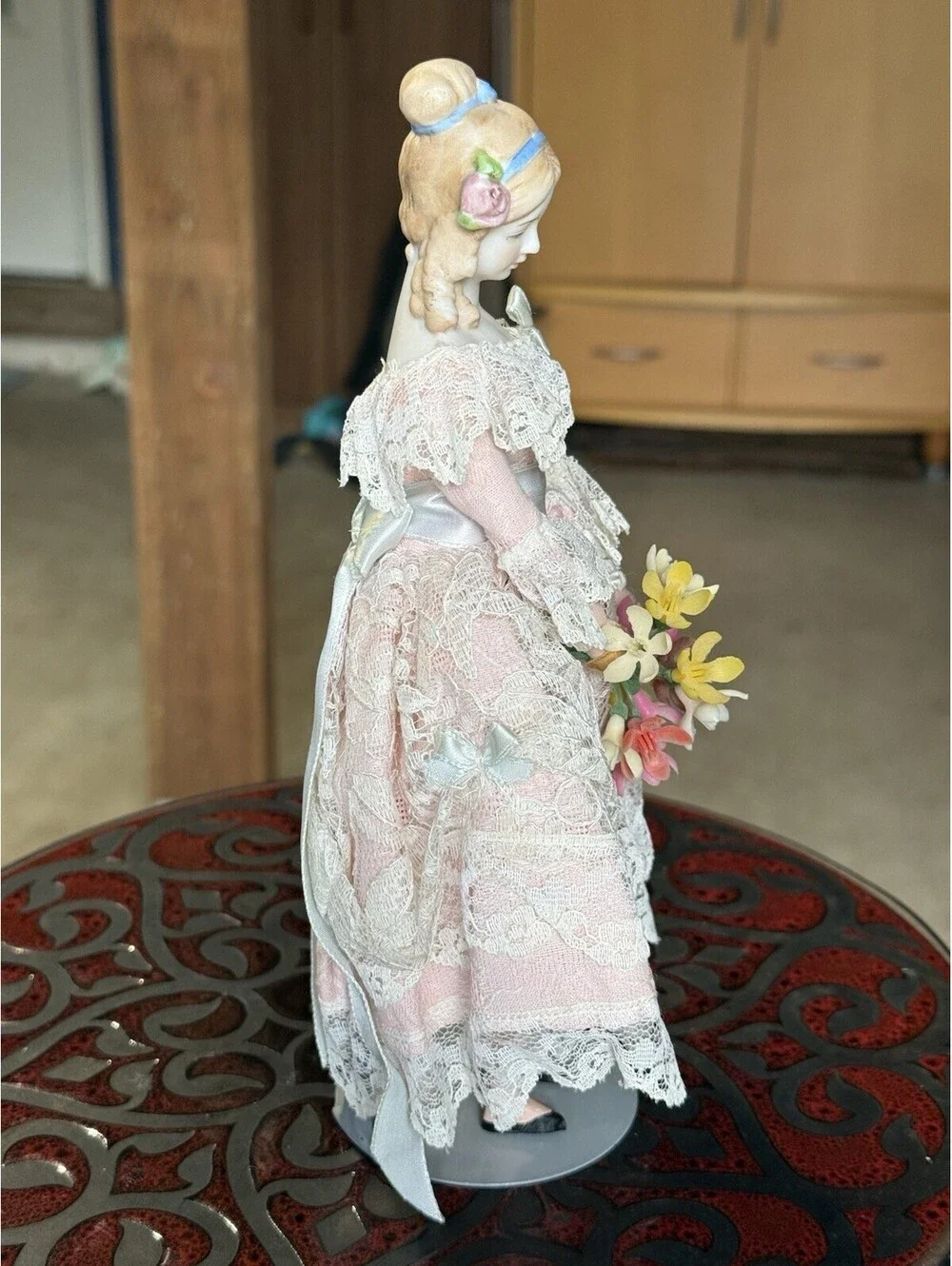 vtg porcelain doll Holding Flowers With Stand